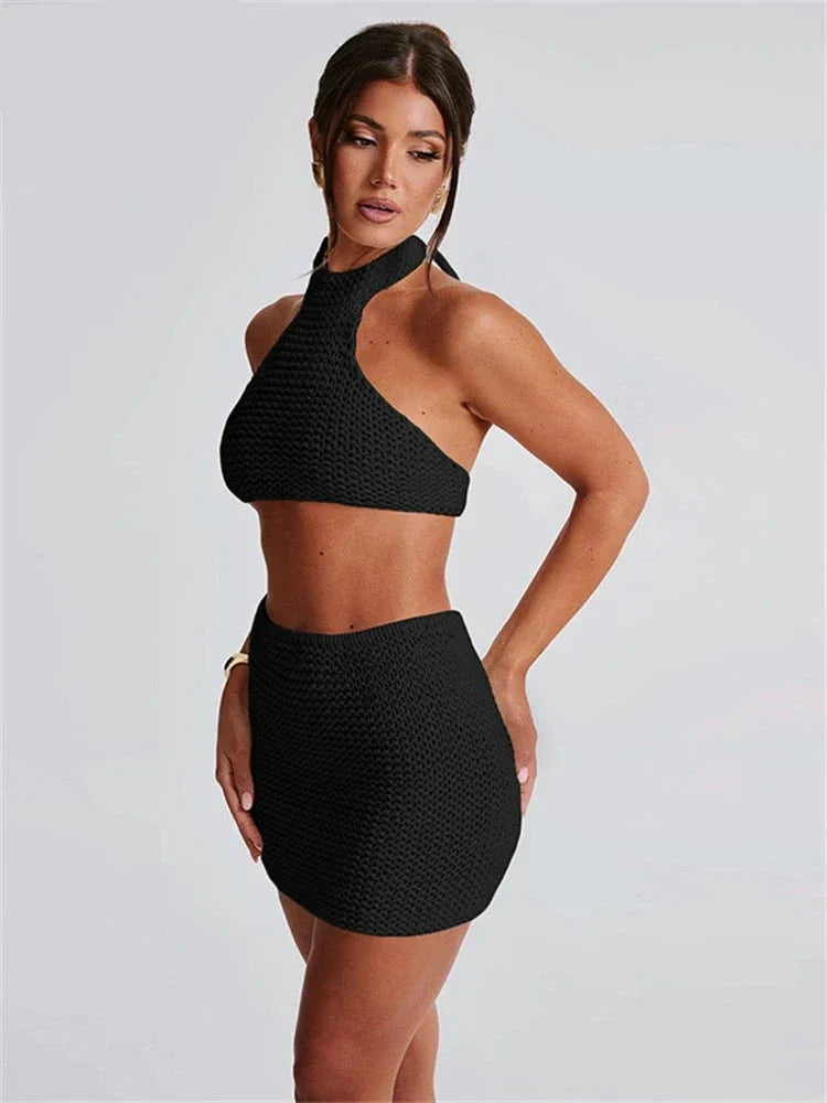 Woman wearing cream knit halter top and mini skirt set
