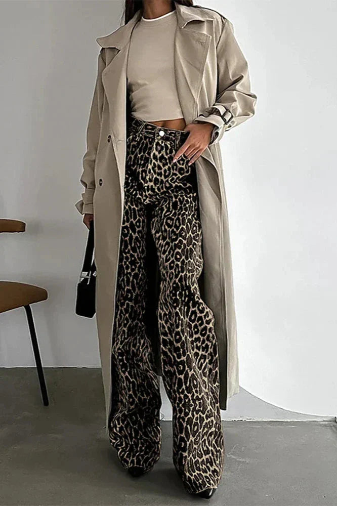 Woman wearing leopard print wide leg jeans and beige trench coat