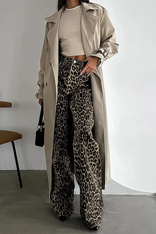 Woman wearing leopard print wide leg jeans and beige trench coat