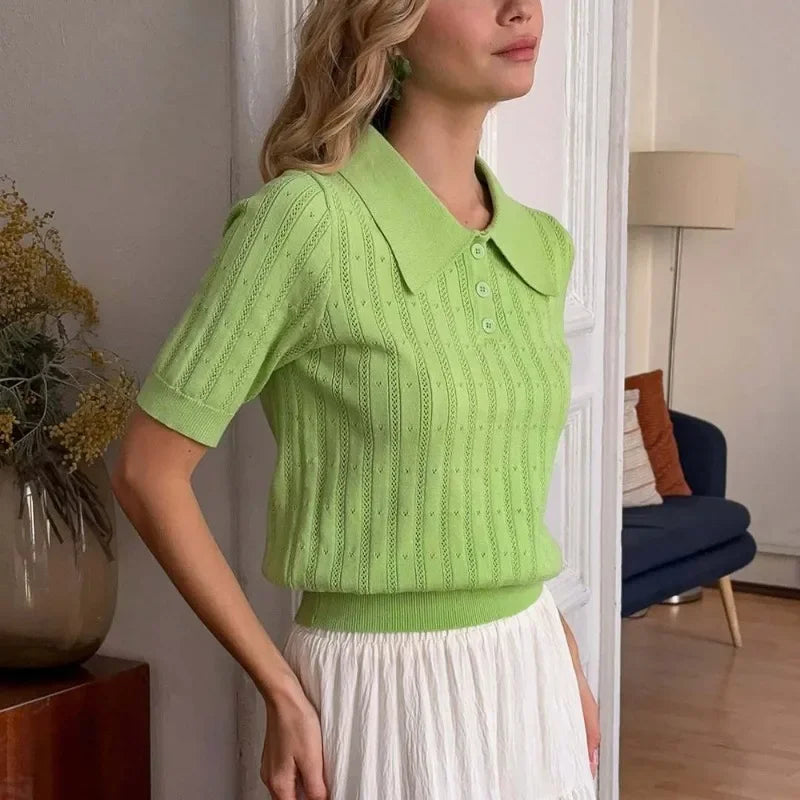 Woman wearing light pink pointelle knit polo shirt