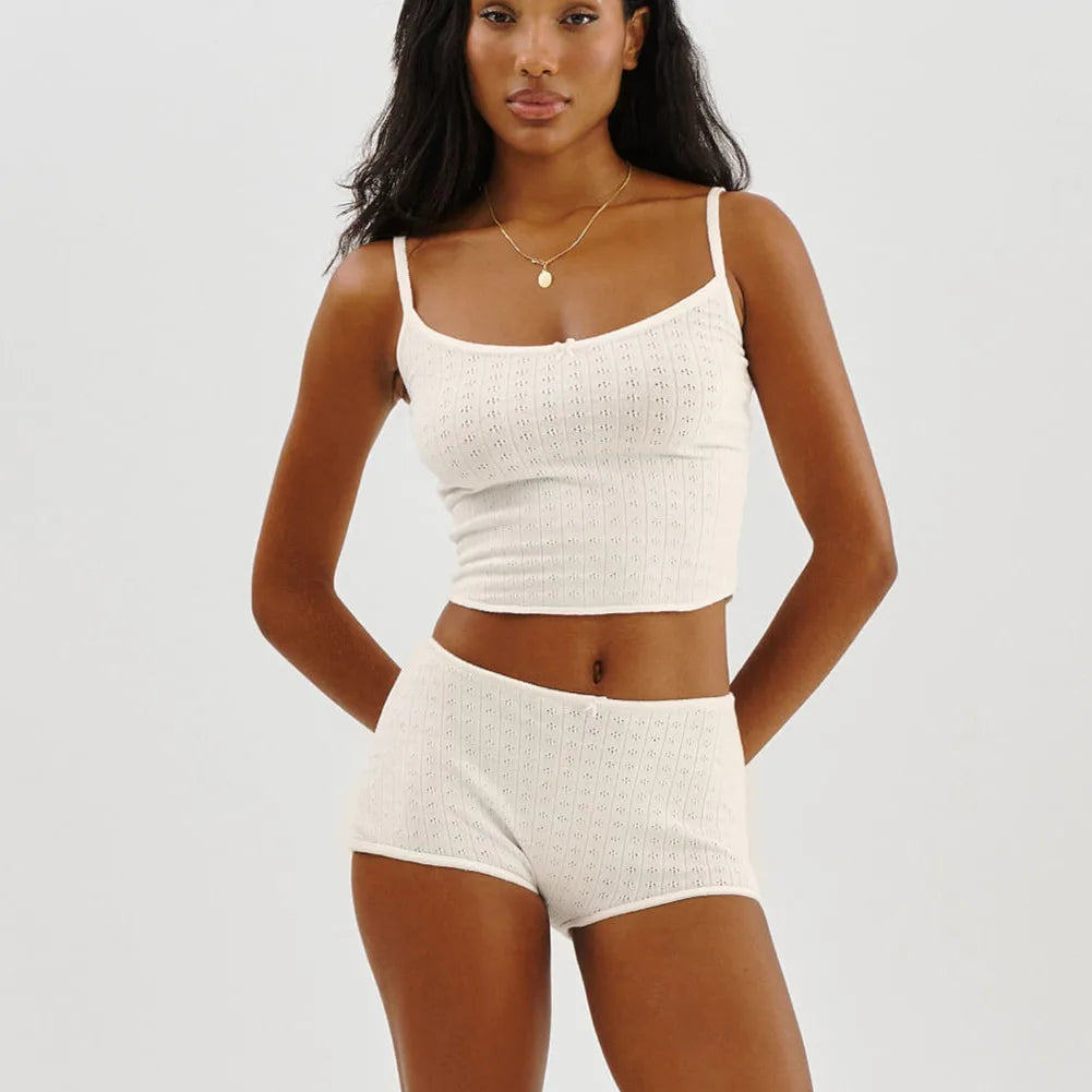 Woman in dusty rose ribbed knit pajama set with bow details