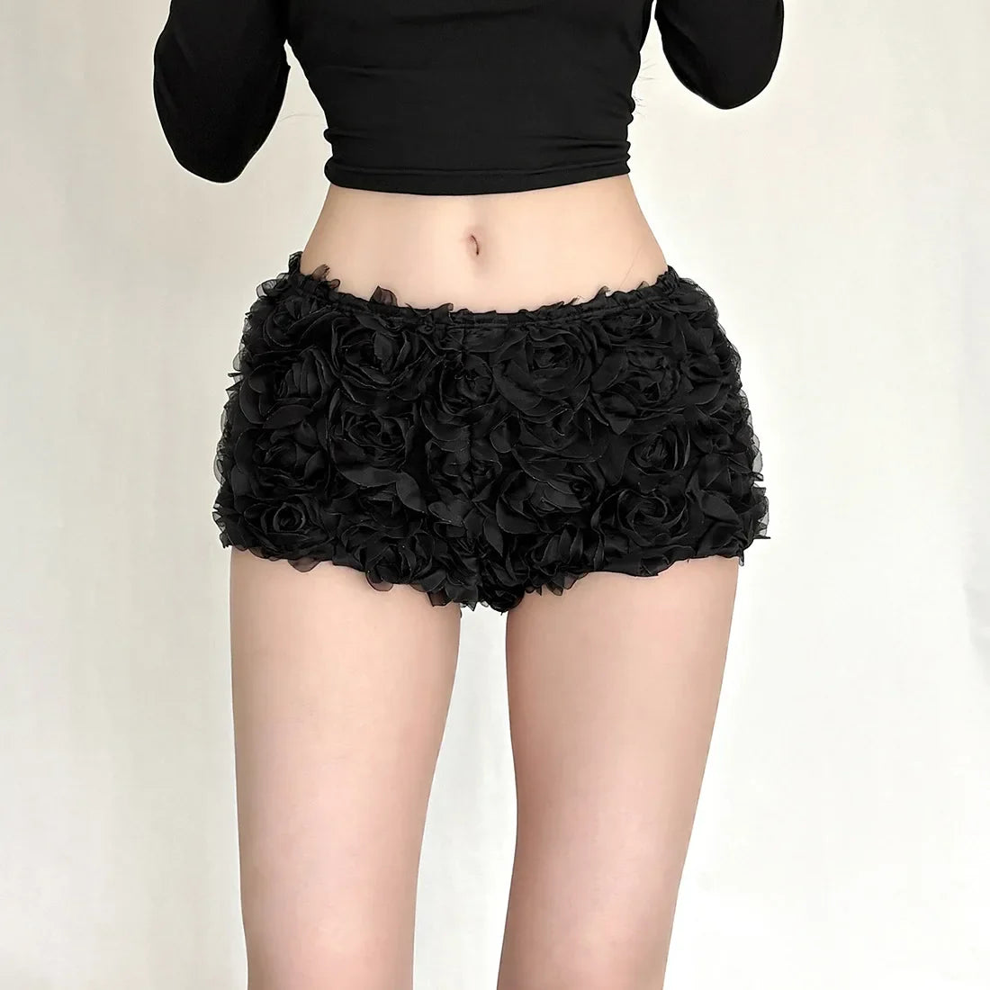 Woman wearing red rose applique shorts