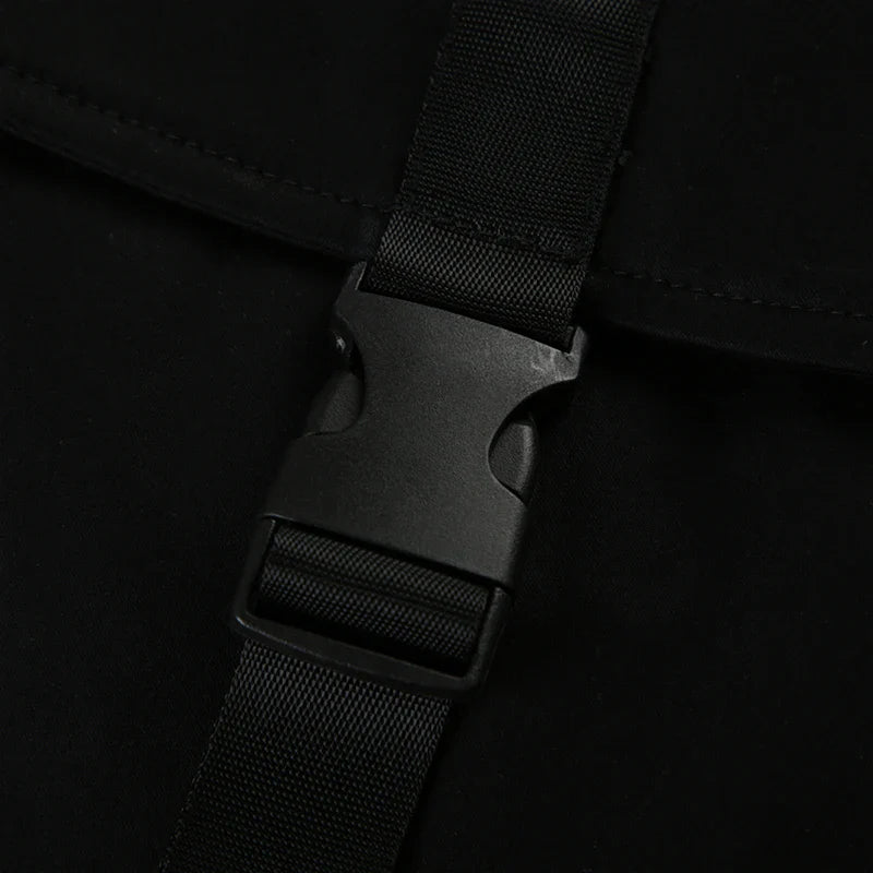 Black twill shorts with belted waist and cargo pockets