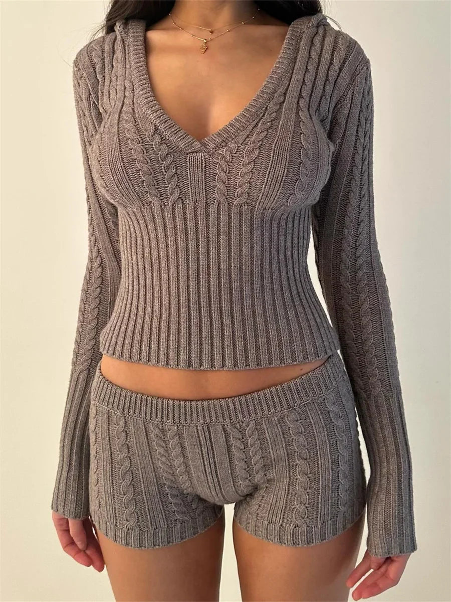 Woman wearing gray knit hoodie and shorts set