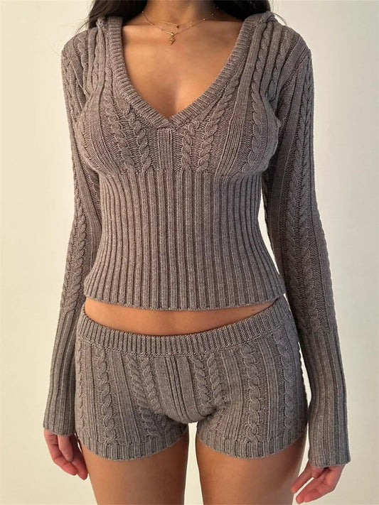 Woman wearing gray knit hoodie and shorts set