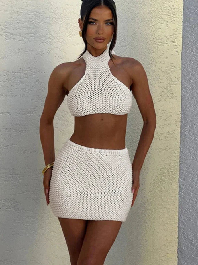 Woman wearing cream knit halter top and mini skirt set