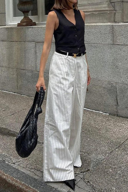 Woman wearing white and gray striped linen wide-leg pants