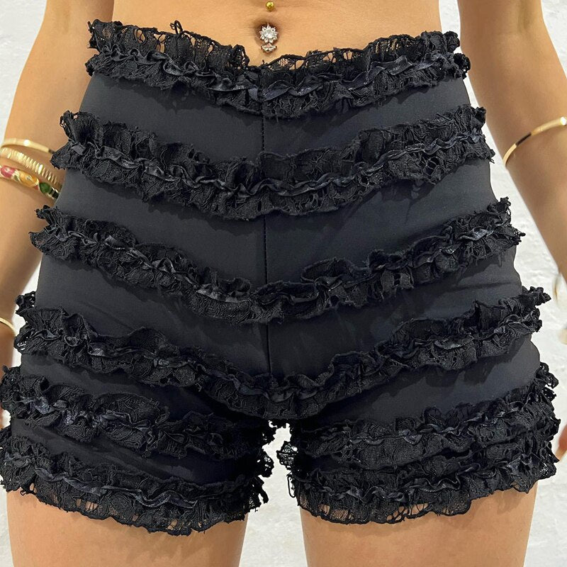 Woman wearing a white ruffle-tiered lace shorts