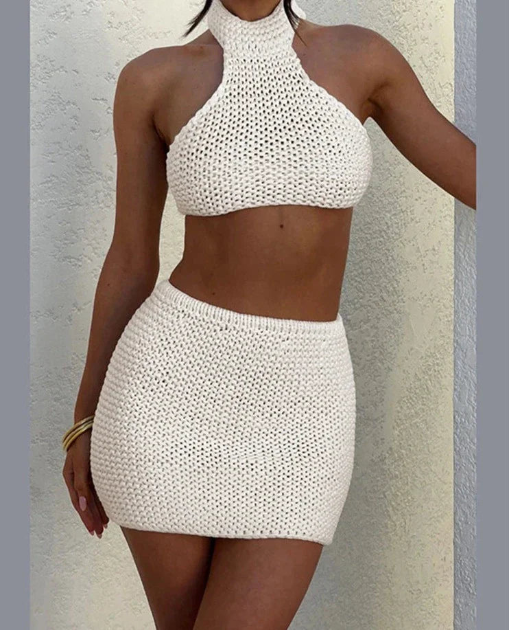 Woman wearing cream knit halter top and mini skirt set
