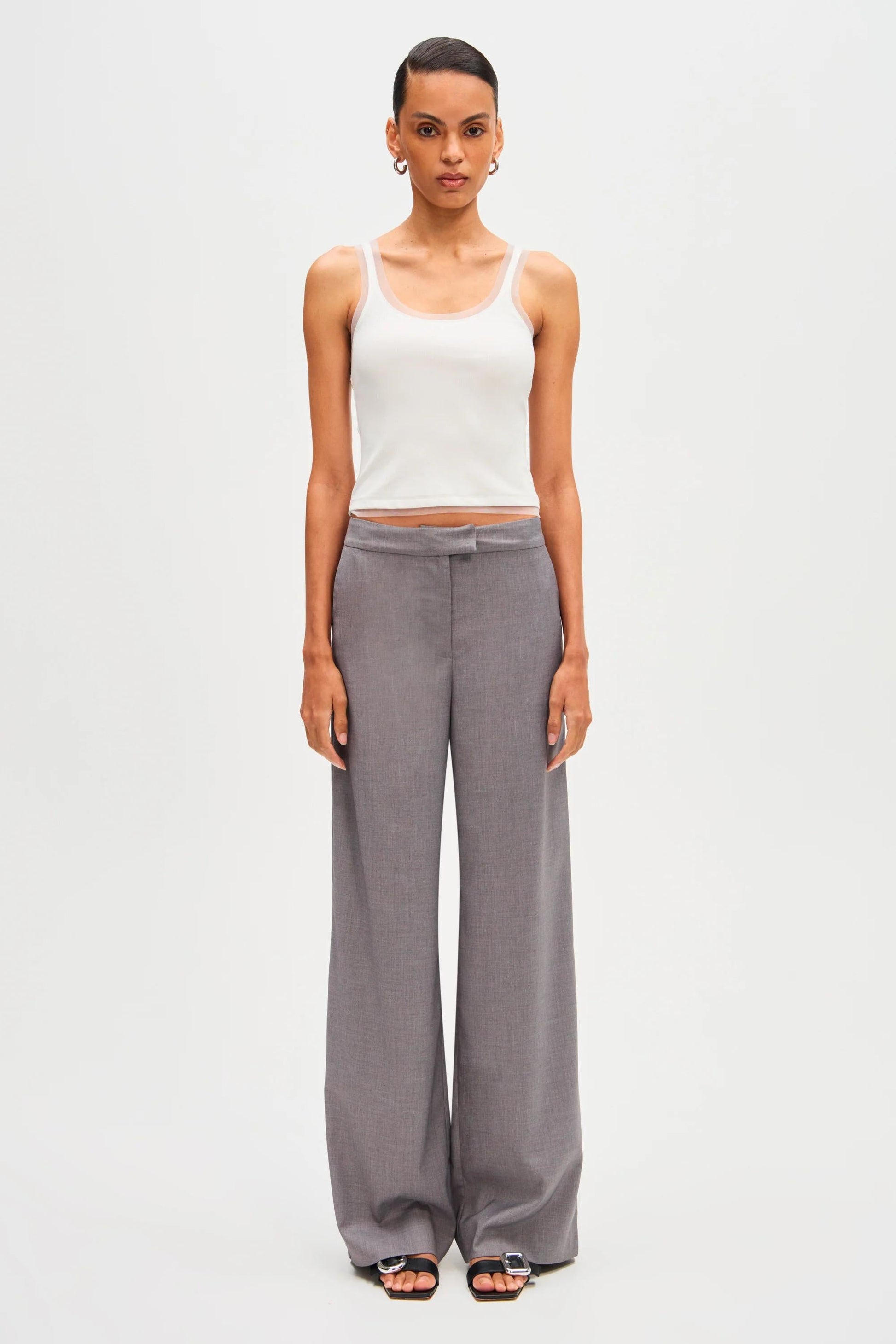 Woman in gray wool blend pant suit