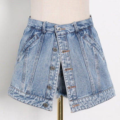 Woman wearing light wash denim skort with button detail