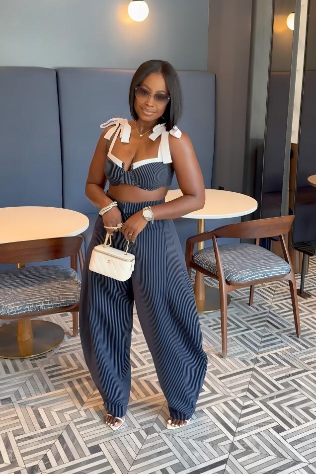 Woman in blue and white striped two-piece set