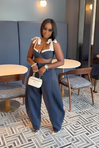Woman in blue and white striped two-piece set
