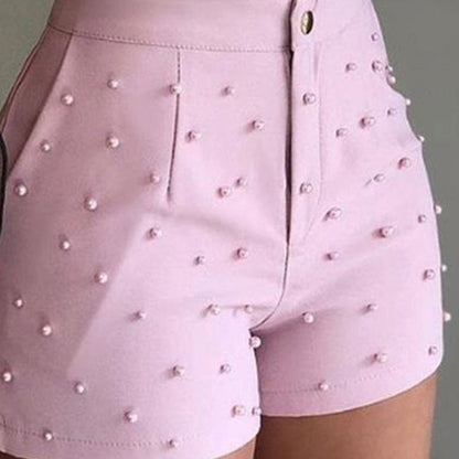 Pink faux leather shorts with pearl embellishments
