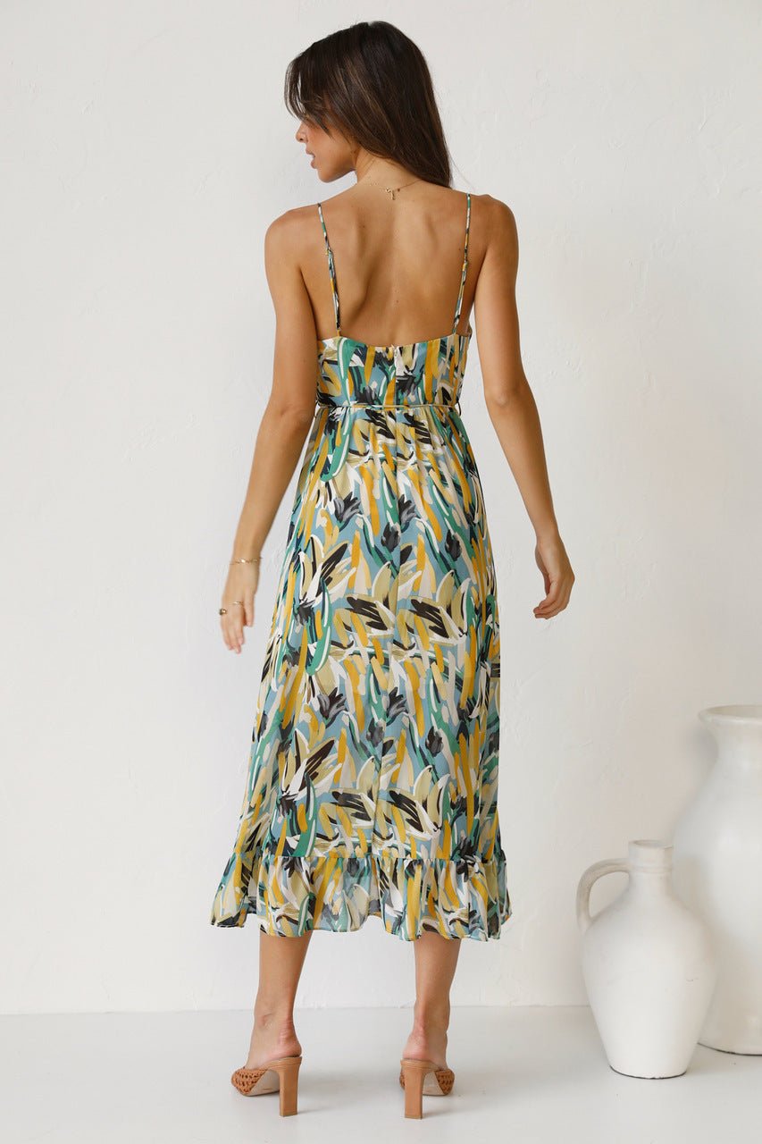 Woman in flowing multi-colored chiffon midi dress