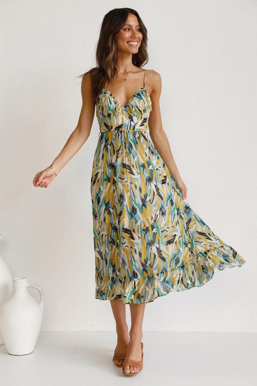 Woman in flowing multi-colored chiffon midi dress