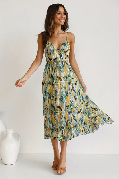 Woman in flowing multi-colored chiffon midi dress