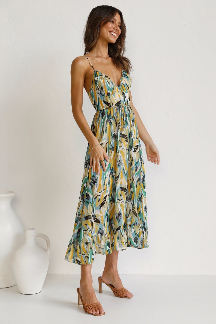 Woman in flowing multi-colored chiffon midi dress