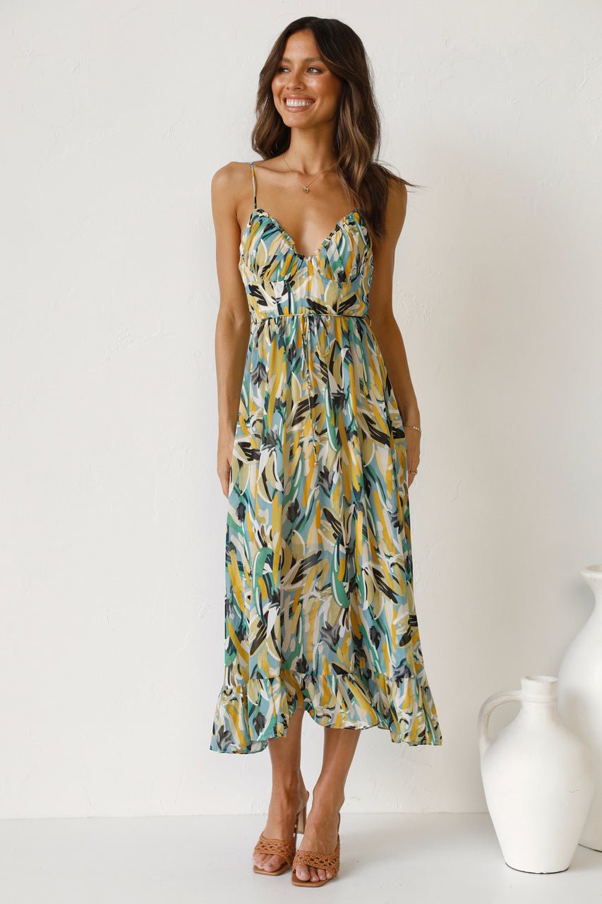 Woman in flowing multi-colored chiffon midi dress