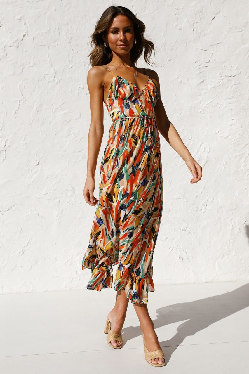 Woman in flowing multi-colored chiffon midi dress