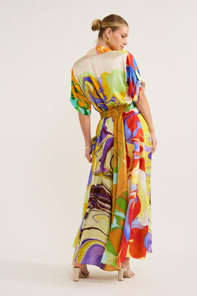 Woman wearing multicolor marble print satin skirt set