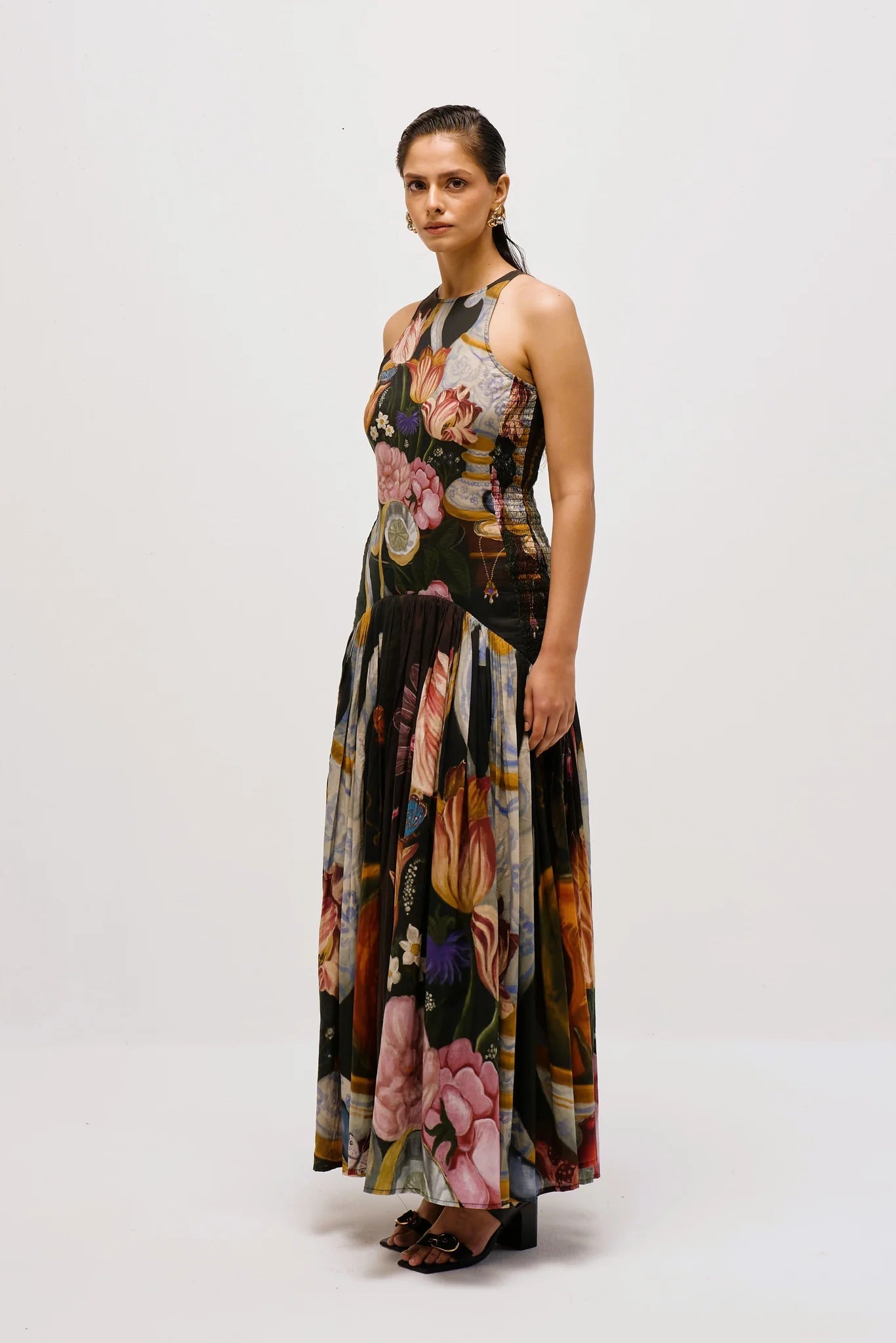 Woman in floral print chiffon maxi dress