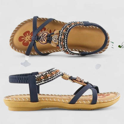 Cobalt Blue - Faux-leather flat slingback sandals featuring a beaded medallion centerpiece, embroidered instep strap, and contrast stitching along the sole edge.