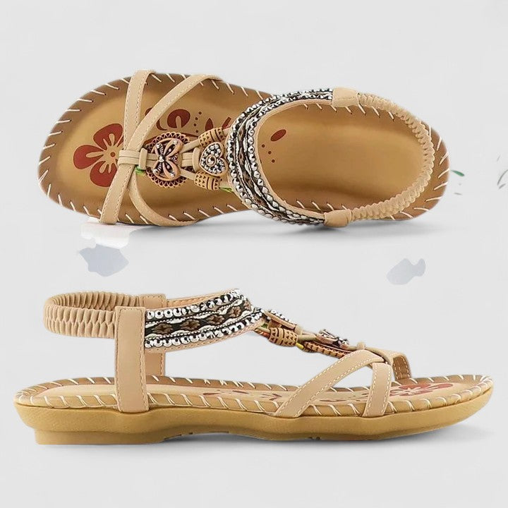 Mahogany Brown - Faux-leather flat slingback sandals featuring a beaded medallion centerpiece, embroidered instep strap, and contrast stitching along the sole edge.