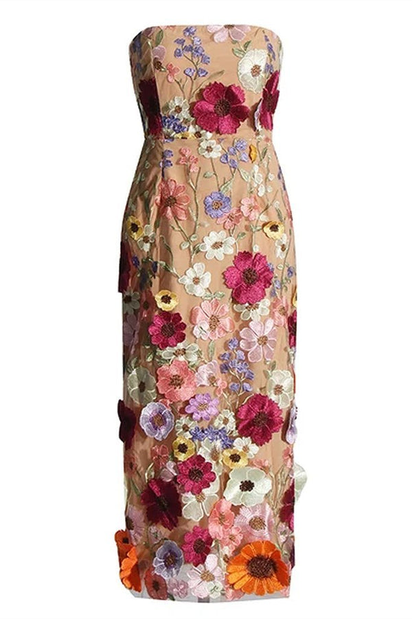 Woman in strapless tulle midi dress with colorful floral appliqués