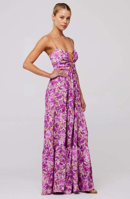 Woman in pink and purple floral print maxi dress