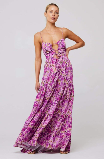 Woman in pink and purple floral print maxi dress