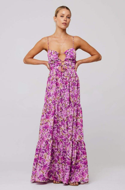 Woman in pink and purple floral print maxi dress