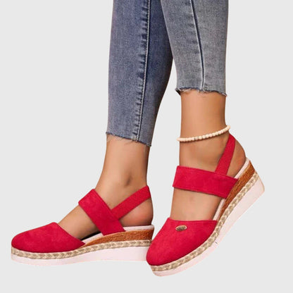 Red - Women's canvas closed-toe platform sandals featuring an elastic slingback strap, layered cork and braided-jute midsole, and a white rubber traction outsole.
