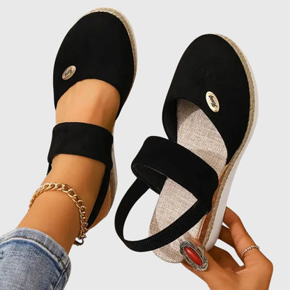 Black - Women's canvas closed-toe platform sandals featuring an elastic slingback strap, layered cork and braided-jute midsole, and a white rubber traction outsole.