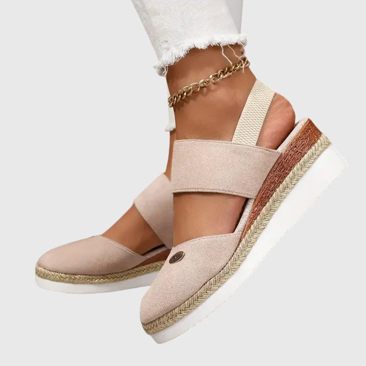 Blue - Women's canvas closed-toe platform sandals featuring an elastic slingback strap, layered cork and braided-jute midsole, and a white rubber traction outsole.