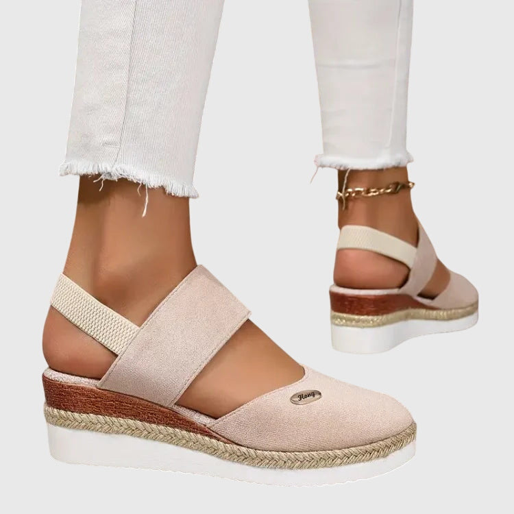 Blue - Women's canvas closed-toe platform sandals featuring an elastic slingback strap, layered cork and braided-jute midsole, and a white rubber traction outsole.