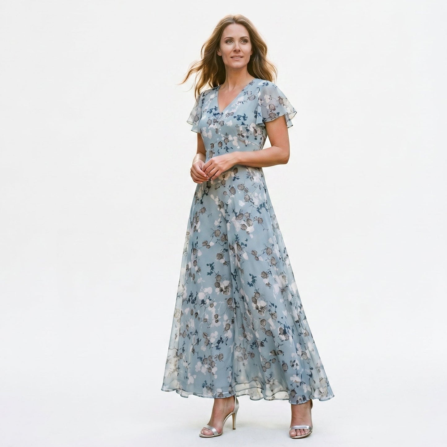 Light Blue - Model wearing a floral flutter-sleeve maxi dress with a V-neckline and flowy silhouette.
