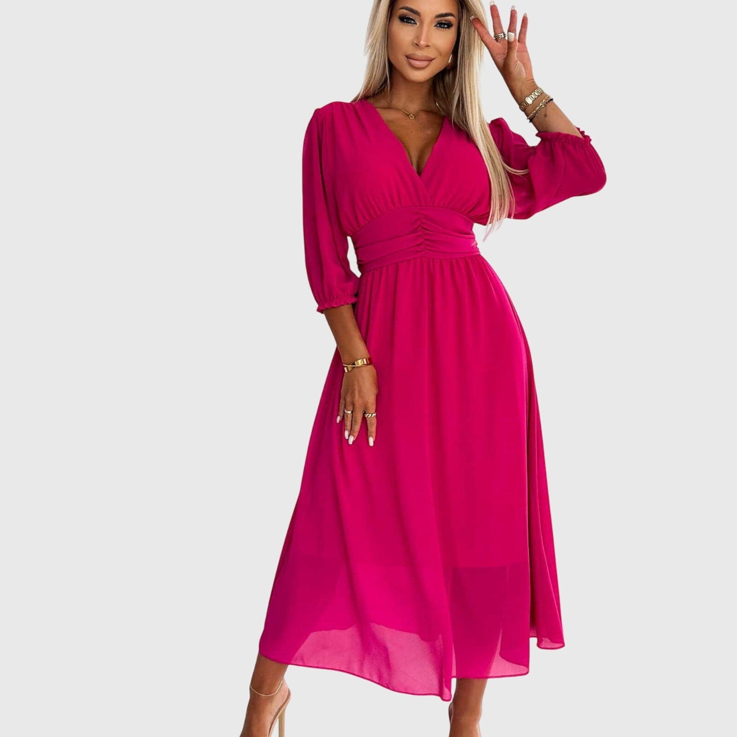 Green - A woman wearing a royal blue chiffon midi dress featuring a V-neckline, ruched empire waist, 3/4 sleeves, and a flowy A-line skirt with a sheer hem.