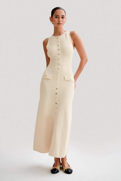 Woman wearing cream ribbed knit maxi dress with buttons