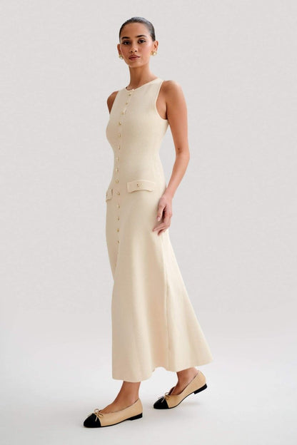 Woman wearing cream ribbed knit maxi dress with buttons