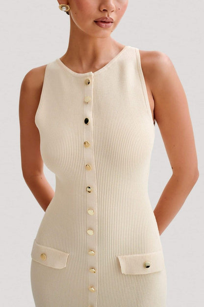 Woman wearing cream ribbed knit maxi dress with buttons