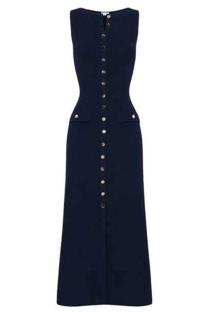 Woman wearing cream ribbed knit maxi dress with buttons