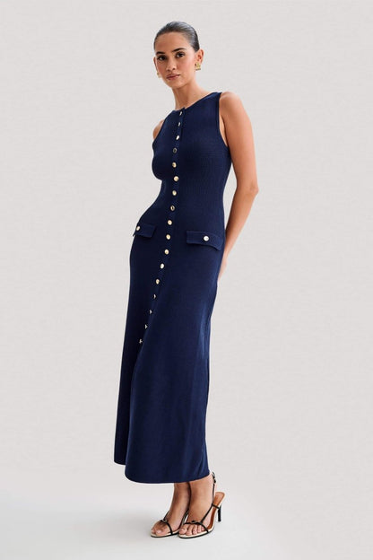 Woman wearing cream ribbed knit maxi dress with buttons