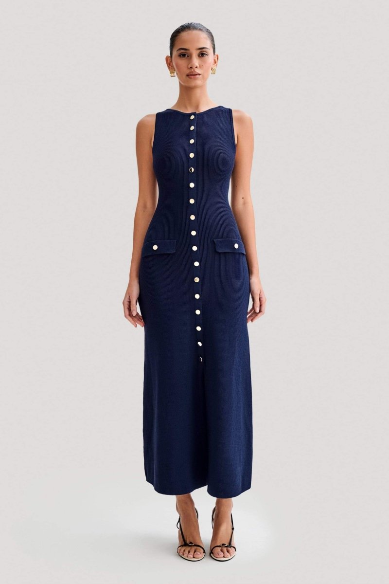 Woman wearing cream ribbed knit maxi dress with buttons