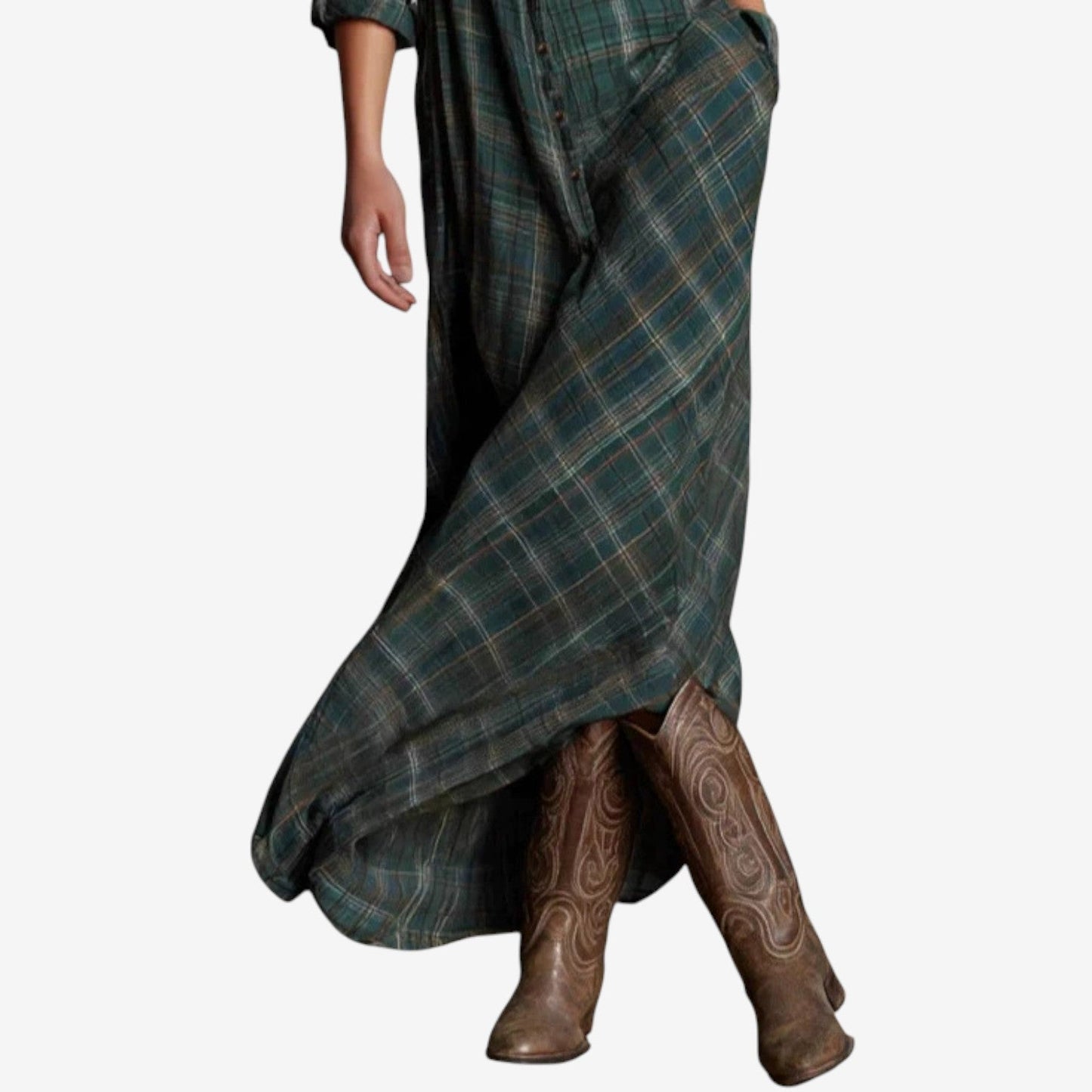 Green - A woman wearing a green plaid long-sleeve maxi shirt dress with a button-down front, styled with brown leather cowboy boots.