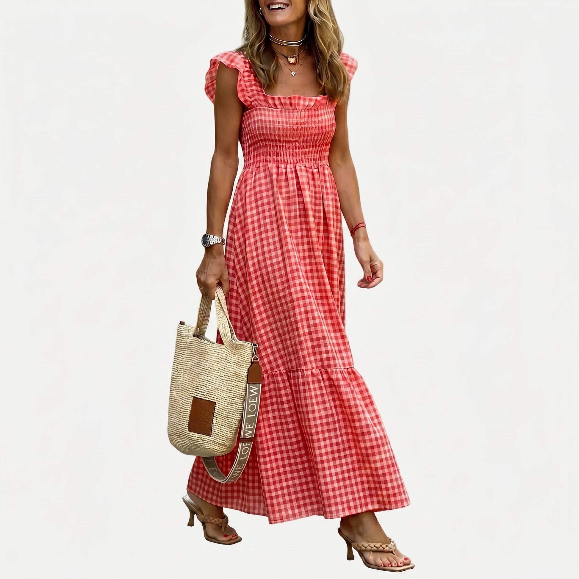 Red - Woman wearing a gingham smocked maxi dress with flutter sleeves and a tiered skirt on a white background