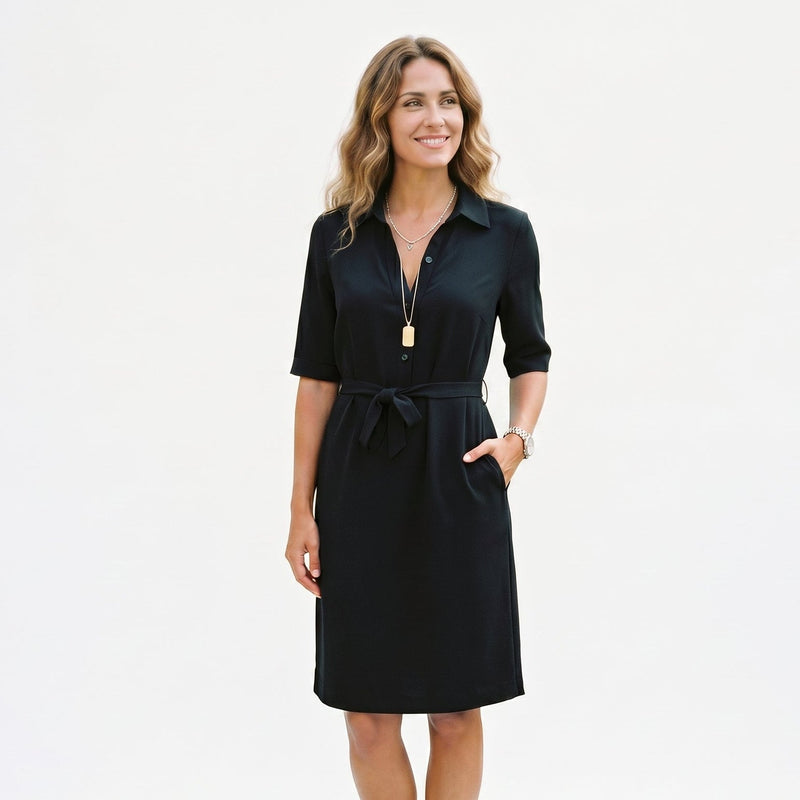 Black - Model wearing a solid collared midi shirtdress with short sleeves, a button-front placket, and a self-tie waist against a white background
