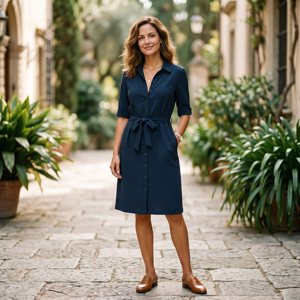 Black - Model wearing a solid collared midi shirtdress with short sleeves, a button-front placket, and a self-tie waist against a white background