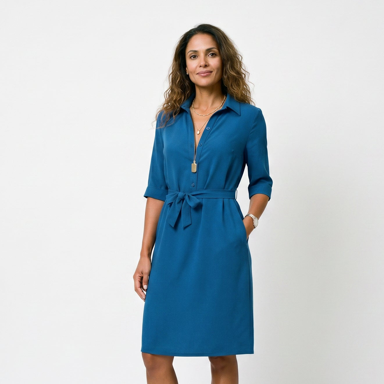 Blue - Model wearing a solid collared midi shirtdress with short sleeves, a button-front placket, and a self-tie waist against a white background