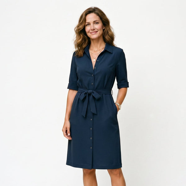 Navy Blue - Model wearing a solid collared midi shirtdress with short sleeves, a button-front placket, and a self-tie waist against a white background